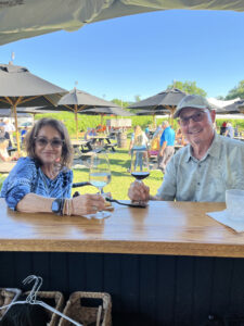 Couple enjoying a glass of wine at FLIGHT located at Johnson Estate Winery